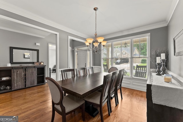 1050 Double Branches Ln, Dallas, GA 30132 - dining space with a chandelier, wood finished floors, ornamental molding, and wainscoting