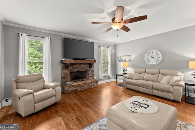 1050 Double Branches Ln, Dallas, GA 30132 - living area featuring a ceiling fan, wood finished floors, crown molding, a fireplace, and baseboards