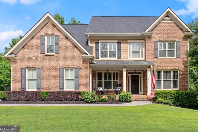 1050 Double Branches Ln, Dallas, GA 30132 - view of front of property with a porch, a front yard, and brick siding