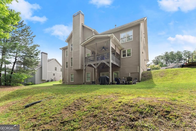 1050 Double Branches Ln, Dallas, GA 30132 - rear view of property featuring a ceiling fan, a yard, and a chimney