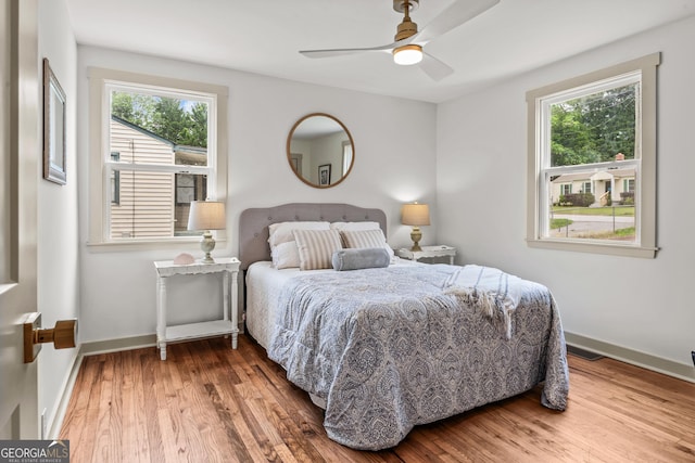 492 Clover St, Athens, GA 30606 - bedroom with multiple windows, wood finished floors, baseboards, and ceiling fan