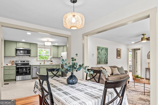 492 Clover St, Athens, GA 30606 - dining room with a chandelier, ceiling fan, and recessed lighting