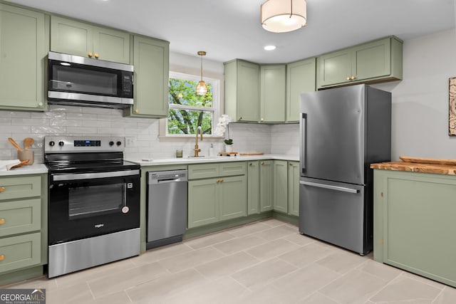 492 Clover St, Athens, GA 30606 - kitchen featuring green cabinets, stainless steel appliances, and light countertops