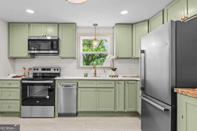 492 Clover St, Athens, GA 30606 - kitchen featuring green cabinetry, appliances with stainless steel finishes, a sink, light countertops, and recessed lighting
