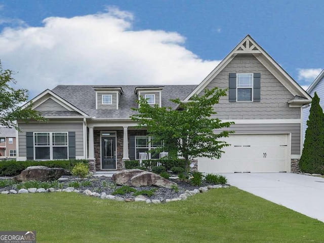 631 Naturewalk Blvd, Dallas, GA 30132 - craftsman-style home with driveway, a front yard, stone siding, a garage, and roof with shingles