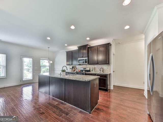 631 Naturewalk Blvd, Dallas, GA 30132 - kitchen with stainless steel appliances, crown molding, dark wood-type flooring, tasteful backsplash, and dark brown cabinets