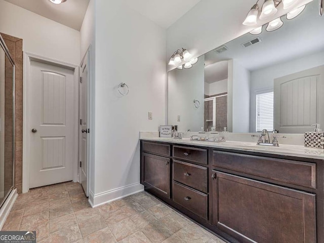 631 Naturewalk Blvd, Dallas, GA 30132 - bathroom featuring a shower stall, double vanity, and stone finish floors