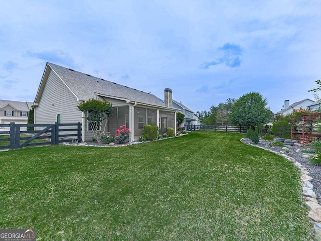 631 Naturewalk Blvd, Dallas, GA 30132 - view of side of home with a fenced backyard, a sunroom, and roof with shingles