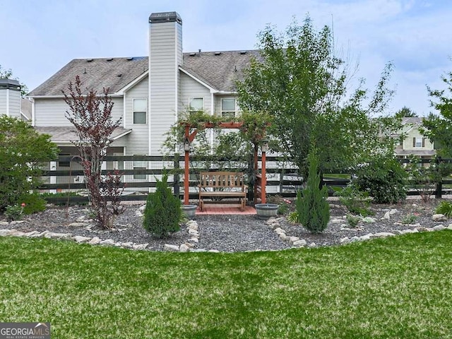 631 Naturewalk Blvd, Dallas, GA 30132 - rear view of house featuring a chimney and roof with shingles
