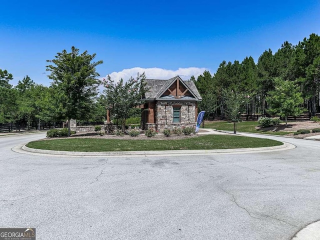 631 Naturewalk Blvd, Dallas, GA 30132 - view of front of house with stone siding and view of scattered trees