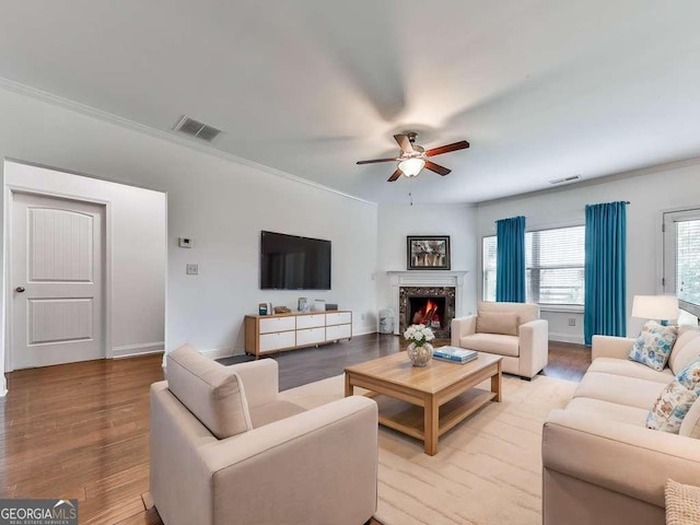 631 Naturewalk Blvd, Dallas, GA 30132 - living area with ceiling fan, ornamental molding, light wood finished floors, and a fireplace