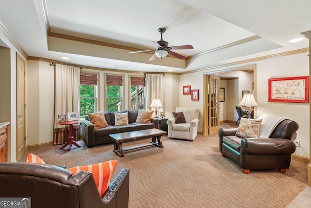 1320 Magnolia Park Cir, Cumming, GA 30040 - living area featuring a raised ceiling, a ceiling fan, light carpet, crown molding, and recessed lighting