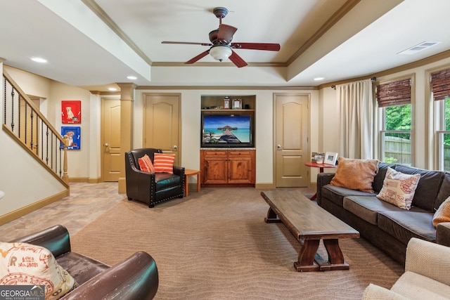 1320 Magnolia Park Cir, Cumming, GA 30040 - living room with ornamental molding, light colored carpet, a tray ceiling, stairs, and a ceiling fan