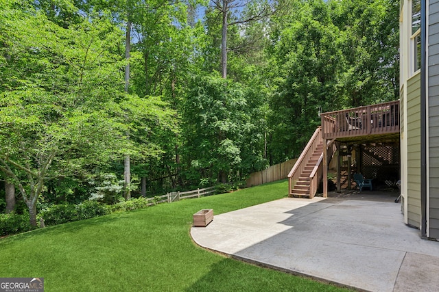 1320 Magnolia Park Cir, Cumming, GA 30040 - fenced backyard with stairway, a patio area, and a deck