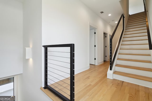 367 Parkway Dr NE Unit 9, Atlanta, GA 30312 - staircase featuring wood finished floors, recessed lighting, and baseboards