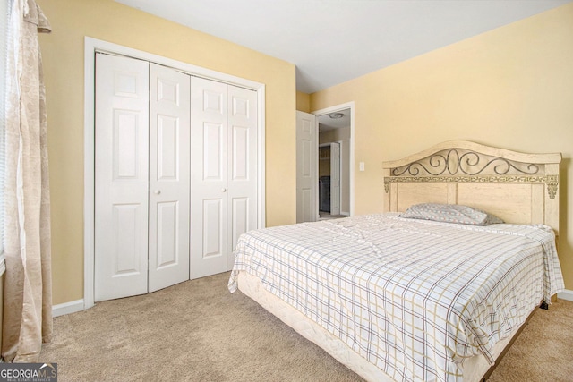 bedroom with carpet and a closet