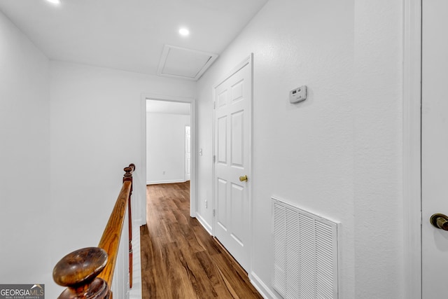 2849 Windsor Forrest Ct, Atlanta, GA 30349 - corridor featuring dark wood-style flooring, an upstairs landing, recessed lighting, attic access, and baseboards