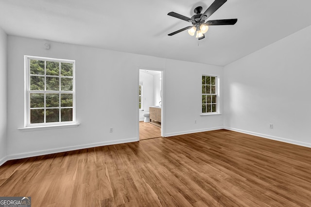2849 Windsor Forrest Ct, Atlanta, GA 30349 - empty room featuring wood finished floors, ceiling fan, baseboards, and lofted ceiling