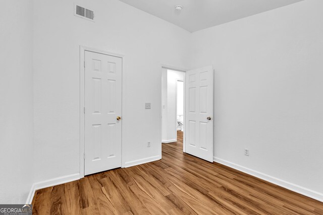 2849 Windsor Forrest Ct, Atlanta, GA 30349 - unfurnished room featuring light wood-style floors, baseboards, and ceiling fan