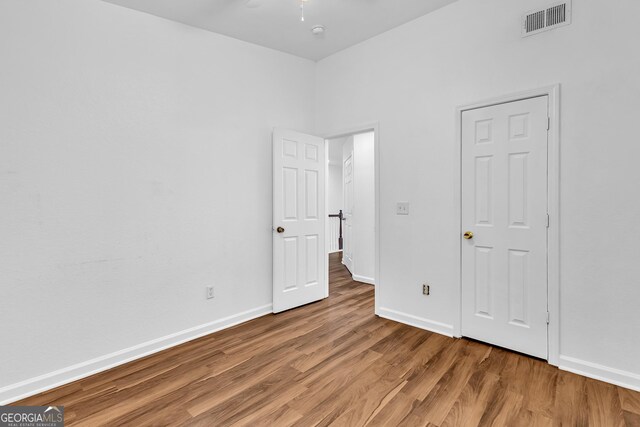 2849 Windsor Forrest Ct, Atlanta, GA 30349 - unfurnished bedroom featuring wood finished floors and baseboards