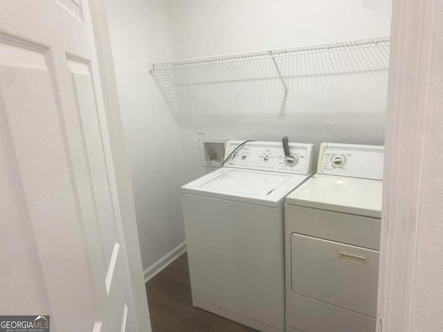 2849 Windsor Forrest Ct, Atlanta, GA 30349 - laundry room with washer and dryer, dark wood-style flooring, and baseboards
