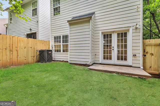 2849 Windsor Forrest Ct, Atlanta, GA 30349 - view of yard featuring french doors and central air condition unit