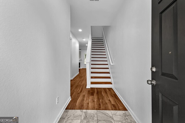 2849 Windsor Forrest Ct, Atlanta, GA 30349 - staircase featuring baseboards, marble finish flooring, and recessed lighting
