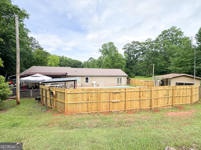 back of house with metal roof