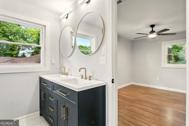 163 Oakcliff Ct, Atlanta, GA 30331 - bathroom featuring double vanity, baseboards, wood finished floors, and ceiling fan