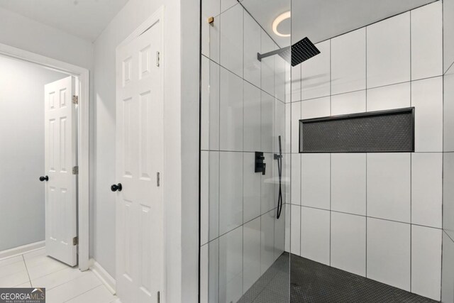 163 Oakcliff Ct, Atlanta, GA 30331 - full bath with a tile shower, baseboards, and tile patterned flooring
