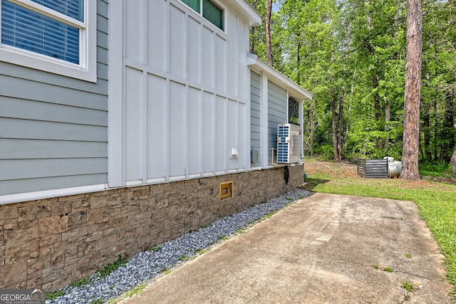 view of home's exterior with a patio area and board and batten siding