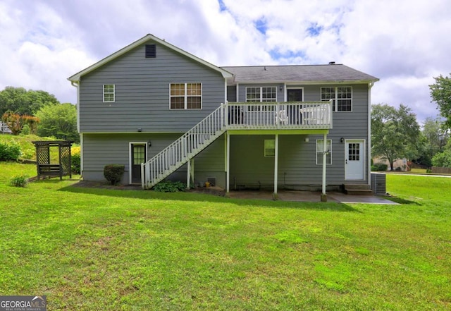 back of house with stairway, a wooden deck, a yard, a patio, and entry steps