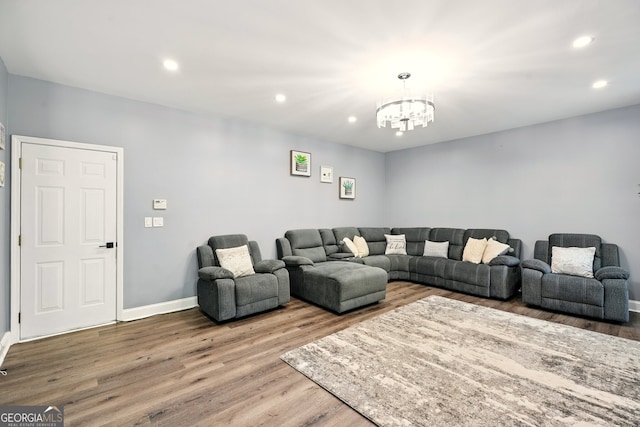 100 Chadwick Pl, Villa Rica, GA 30180 - living area featuring a chandelier, wood finished floors, recessed lighting, and baseboards