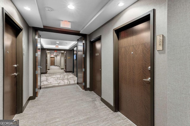 855 Peachtree St NE Unit 1508, Atlanta, GA 30308 - corridor with carpet flooring, recessed lighting, baseboards, and a tray ceiling