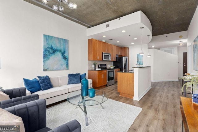 855 Peachtree St NE Unit 1508, Atlanta, GA 30308 - living room featuring light wood finished floors, recessed lighting, and baseboards