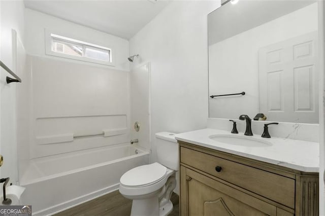 full bathroom with toilet, vanity, shower / bath combination, and wood finished floors