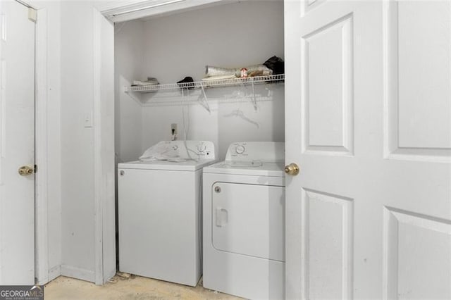 washroom featuring washing machine and dryer