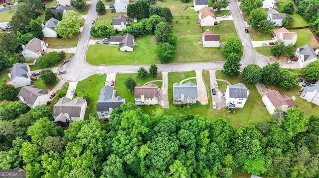 aerial view of property and surrounding area with nearby suburban area