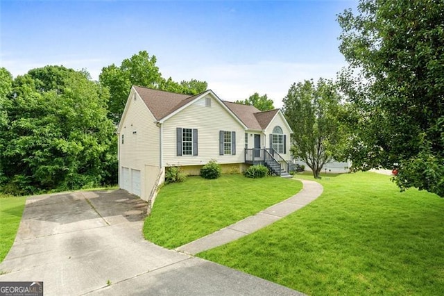 view of front of house featuring an attached garage, driveway, and a front yard