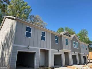 4261 Notting Hill Dr SW, Atlanta, GA 30331 - view of front of house featuring an attached garage and board and batten siding