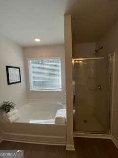4261 Notting Hill Dr SW, Atlanta, GA 30331 - bathroom featuring a bath, a shower stall, and recessed lighting