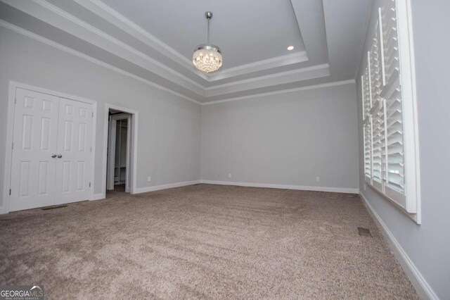 319 Stonebridge Blvd, Bremen, GA 30110 - unfurnished bedroom with carpet flooring, a tray ceiling, crown molding, and baseboards