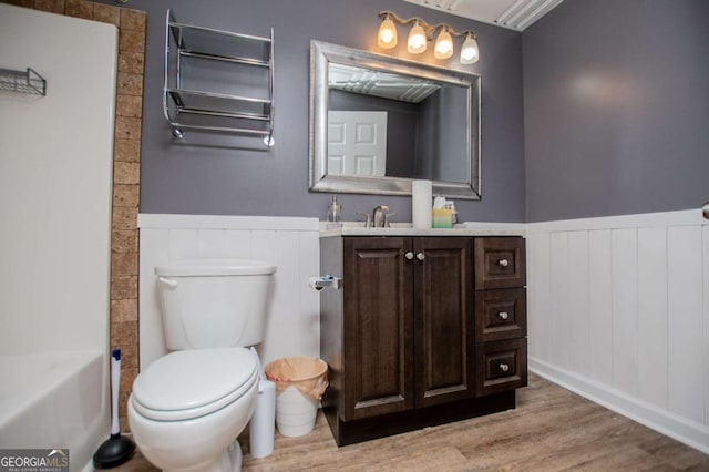 319 Stonebridge Blvd, Bremen, GA 30110 - full bath featuring wainscoting, toilet, wood finished floors, vanity, and a decorative wall