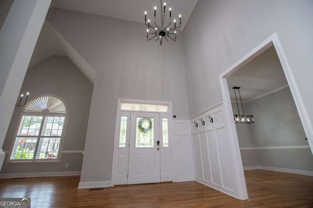 319 Stonebridge Blvd, Bremen, GA 30110 - entrance foyer featuring a chandelier, high vaulted ceiling, wood finished floors, and baseboards
