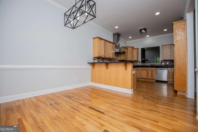 319 Stonebridge Blvd, Bremen, GA 30110 - kitchen with wall chimney range hood, crown molding, dishwasher, dark countertops, and tasteful backsplash