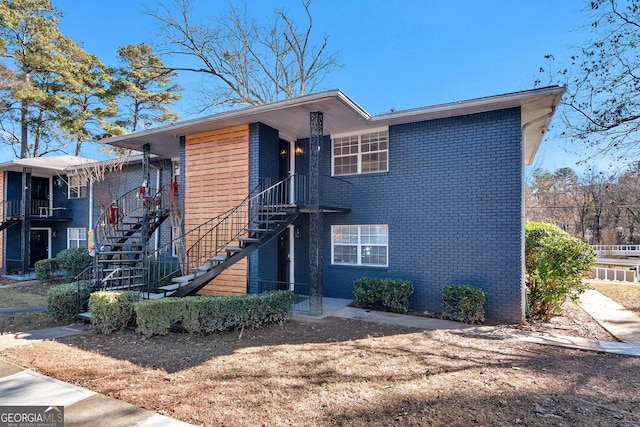 3137 Buford Hwy NE Unit 11, Brookhaven, GA 30329 - view of front of house featuring stairway and brick siding