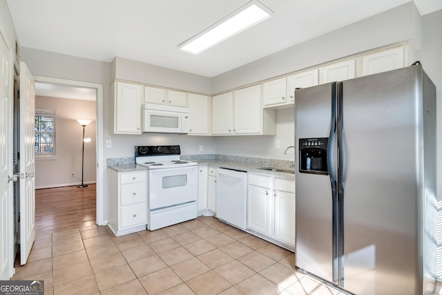 3137 Buford Hwy NE Unit 11, Brookhaven, GA 30329 - kitchen with white appliances, a sink, white cabinetry, and light stone countertops