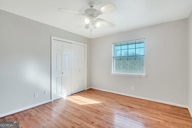 3137 Buford Hwy NE Unit 11, Brookhaven, GA 30329 - unfurnished bedroom featuring wood finished floors, baseboards, and a closet