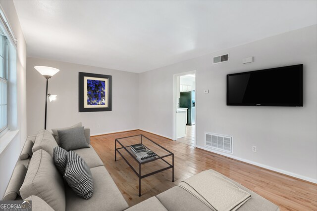 3137 Buford Hwy NE Unit 11, Brookhaven, GA 30329 - living room featuring wood finished floors and baseboards