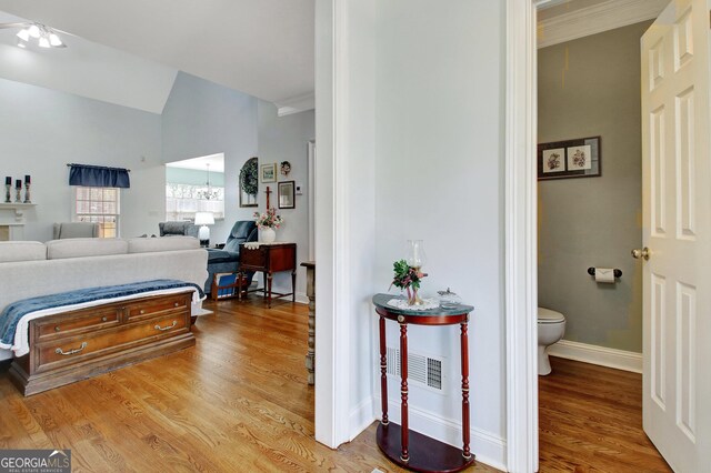 315 Antebellum Way, Fayetteville, GA 30215 - bedroom with wood finished floors, ornamental molding, baseboards, ensuite bath, and vaulted ceiling